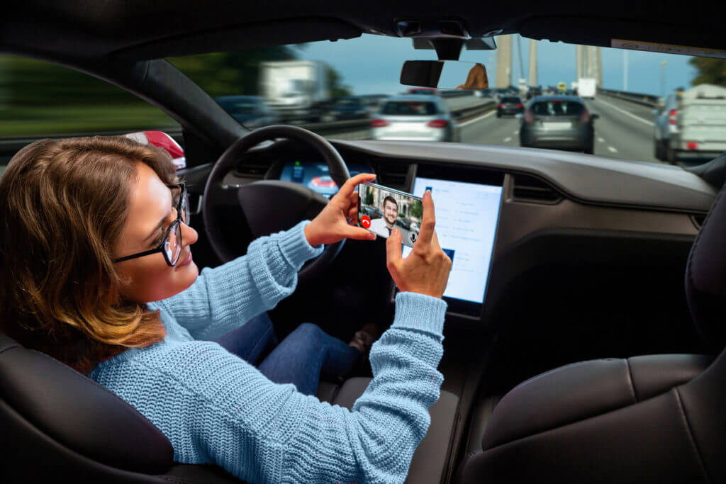 self driving car accident woman holding phone